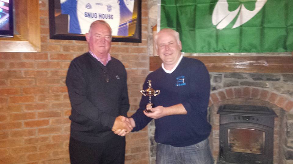 Kildalkey Captain Tom Carroll (right) receives the Ryder Cup from Marcies in 2015